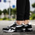 男士休闲运动鞋跑步鞋气垫透气底平底鞋圆头网纱系带k021(黑白色 44)第4张高清大图