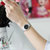 天梭(Tissot)瑞士手表梦幻经典系列贝母表盘石英男表女表白盘罗马刻度T033.410.11.013.01情侣表(黑盘钢带女款)第5张高清大图