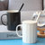 ins北欧简约陶瓷马克杯子咖啡杯带盖勺情侣办公室家用男女喝水杯(上升杯黑白一对（带瓷盖勺）)第4张高清大图